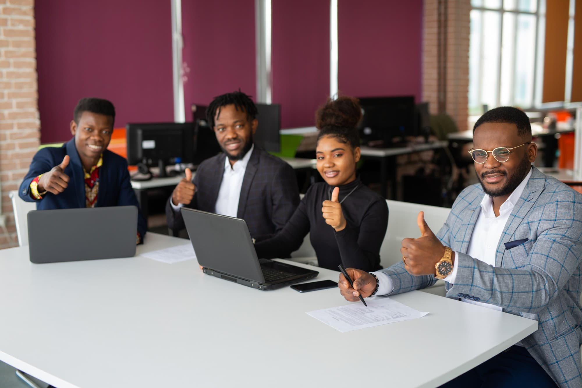 West African entrepreneurs and community leaders collaborating on innovative finance